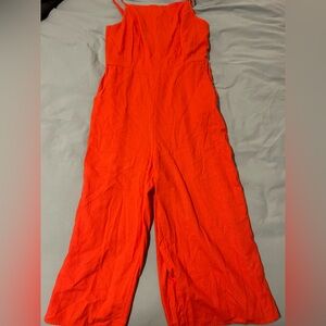 Red-orange bright and bold jumpsuit with pockets